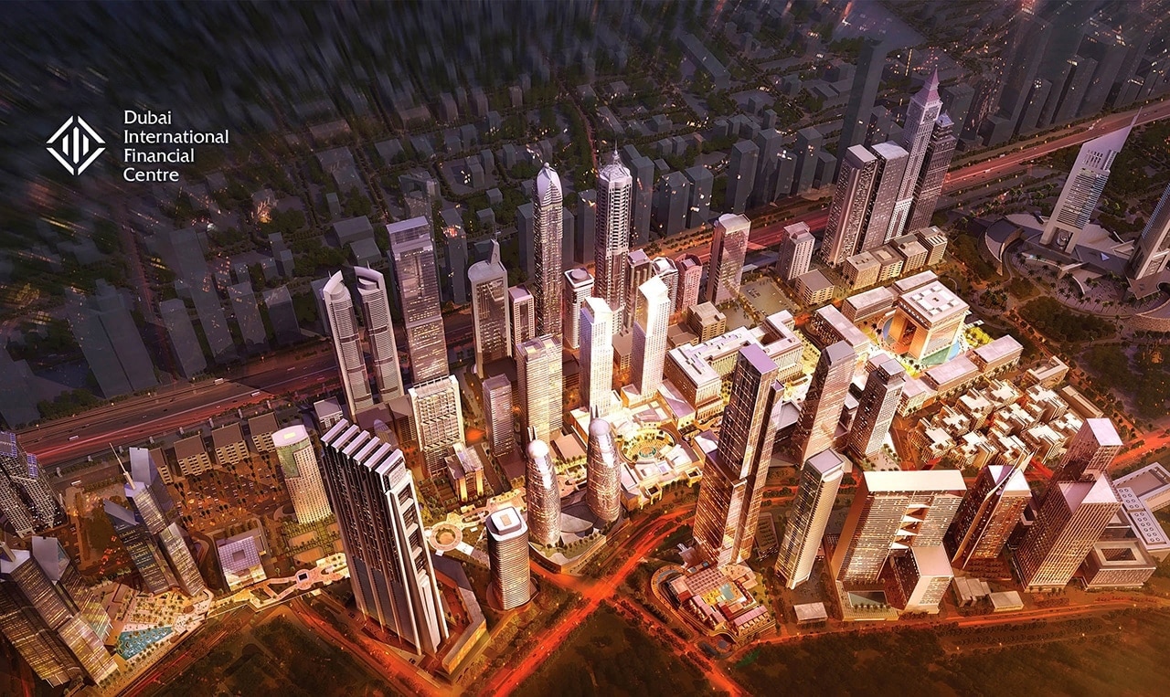 An aerial view of a city at night showcasing its trade show environment.