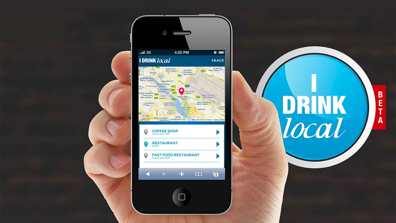 A person using the "I Drink Local" app on their phone.