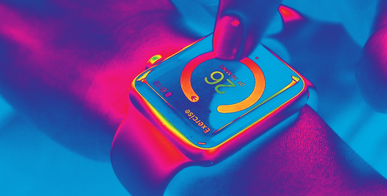 A person's wrist with an apple watch on it.