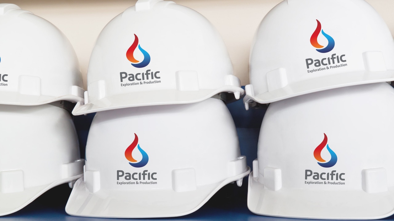 Four hard hats with repositioned logos on them.