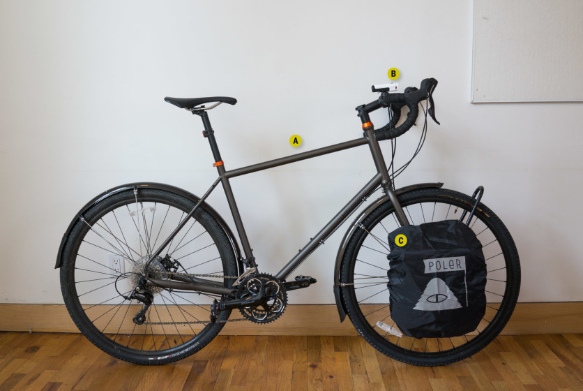 A bike is leaning against a wall.