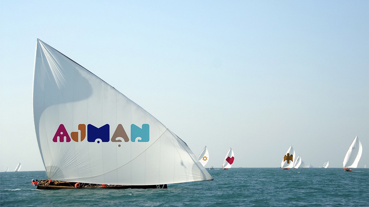 A group of sailboats sailing in the ocean, capturing the essence of an Emirate.