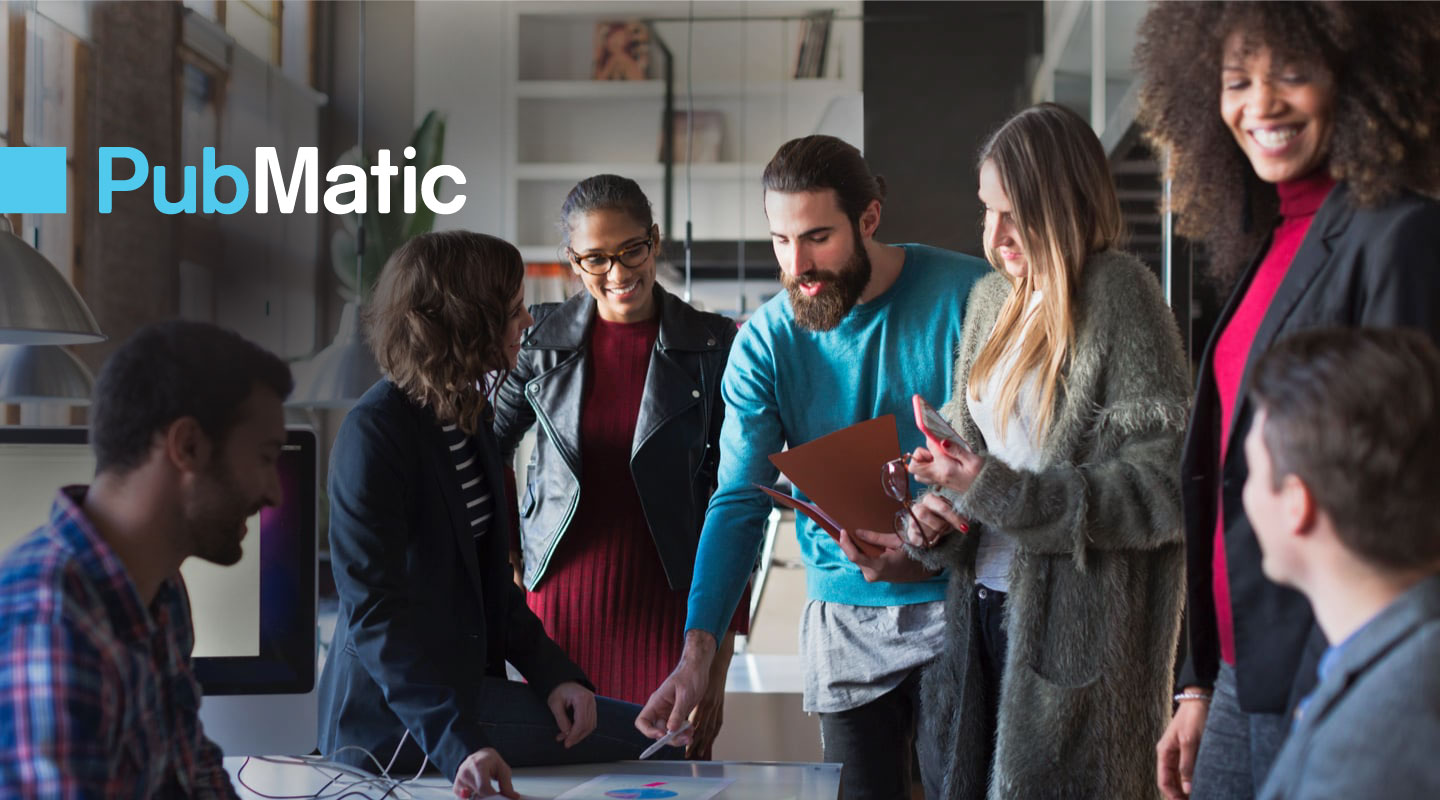 a group of people standing around a table and the logo of PubMatic at the left upper corner