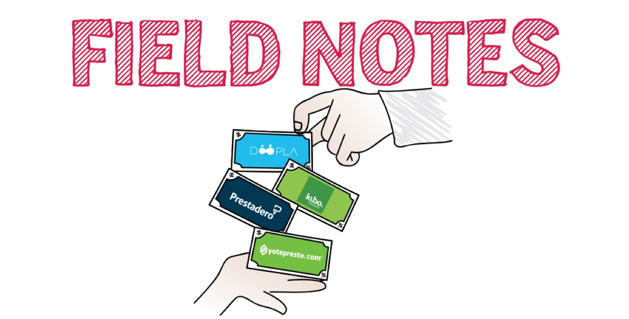 Field notes with a hand holding a stack of cards.