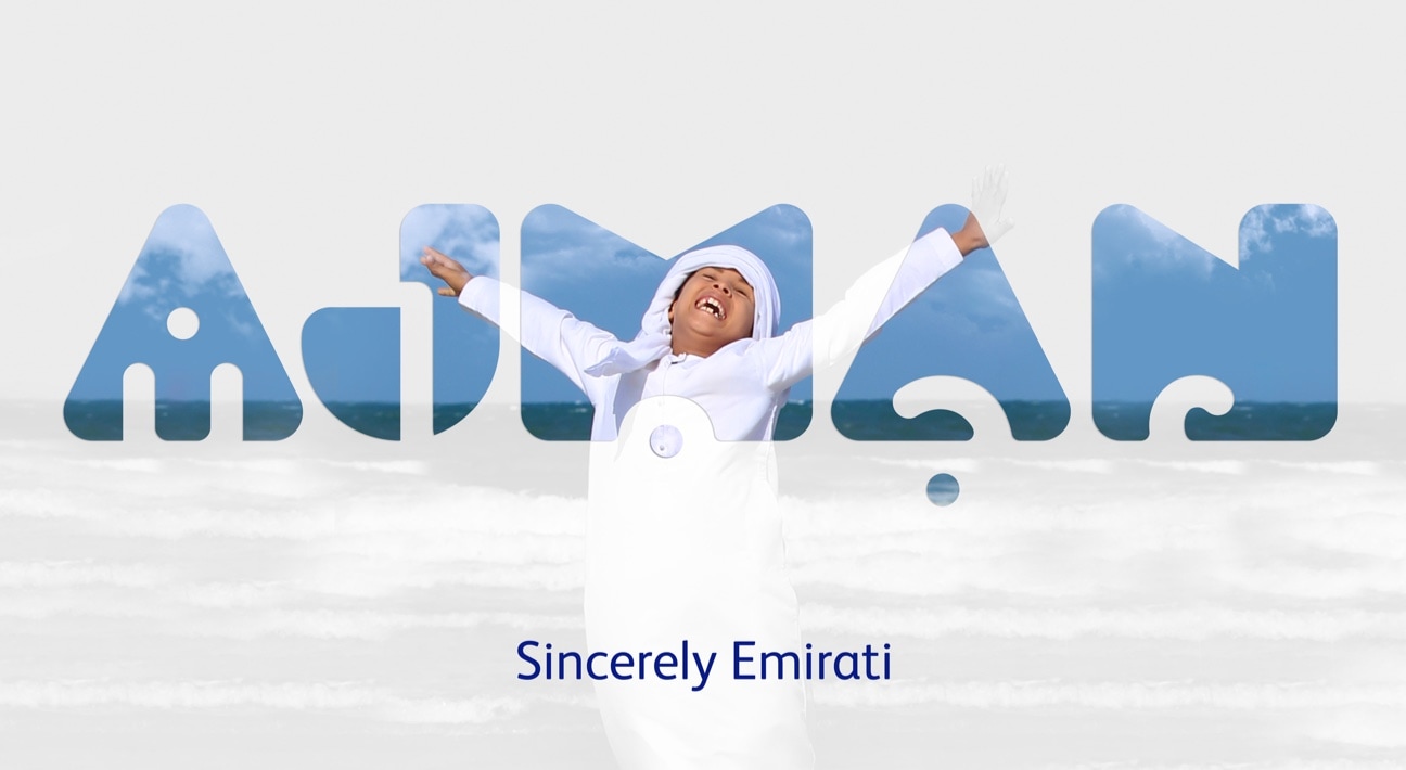 A man with outstretched arms rebrands Ajman Tourism.