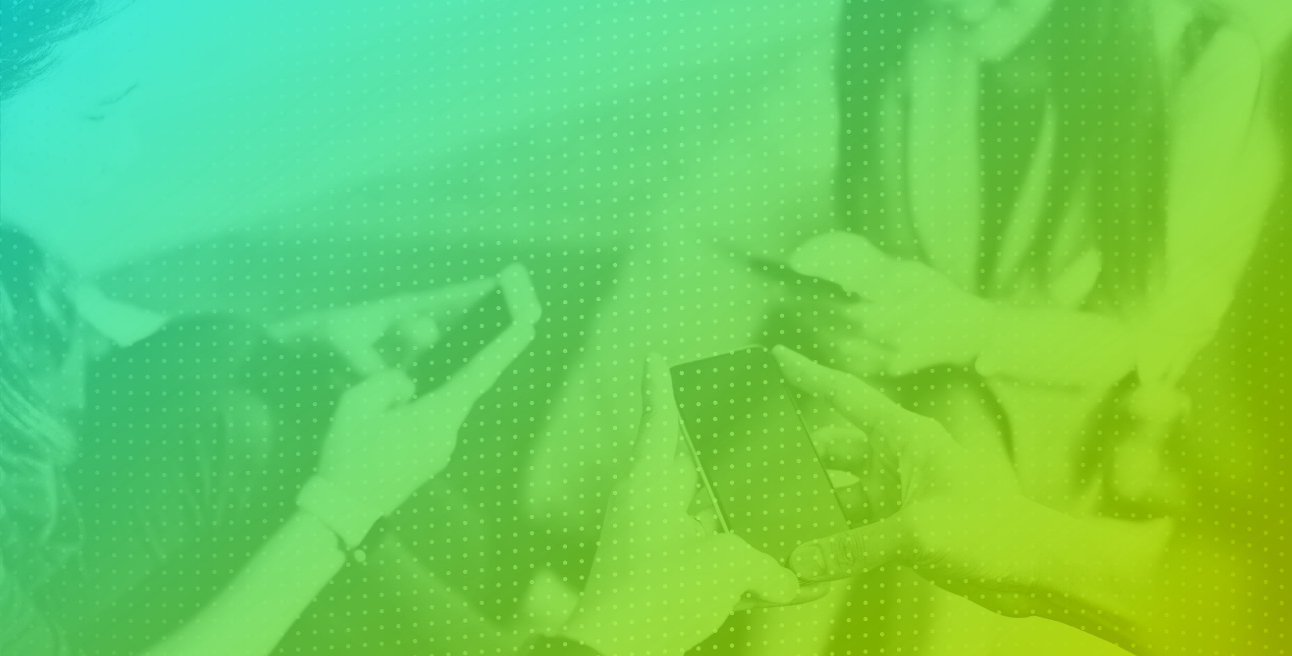 An image of a group of people using their cell phones.