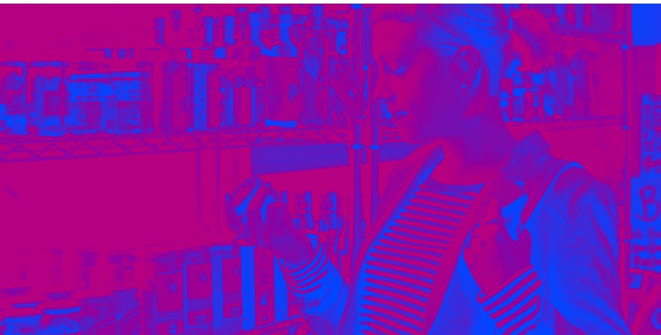 A woman is standing in a store.