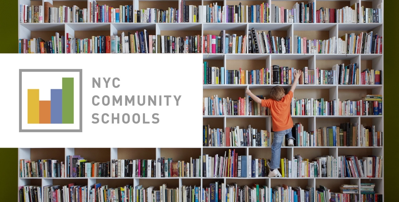 boy climbing for book on high shelf and the logo of UK COMMUNITY SCHOOLS