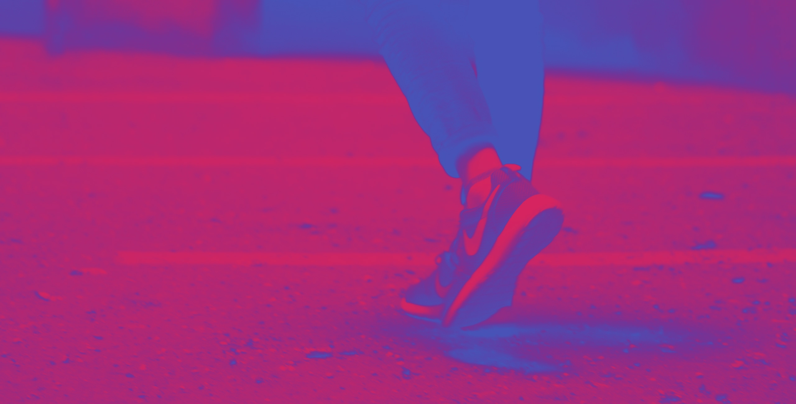 A person showcasing Nike apparel while walking on a street.