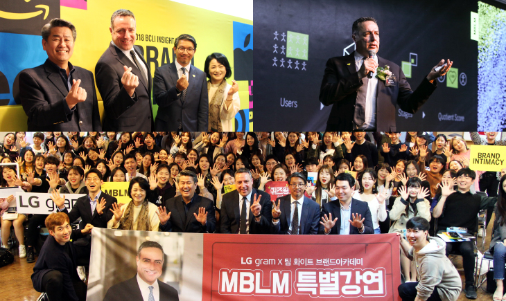 A group of people are holding signs and posing for the camera.