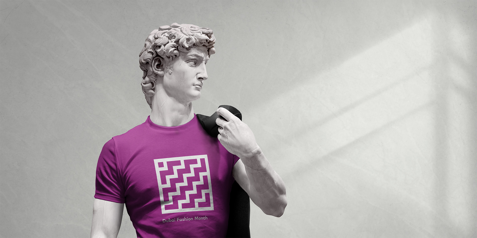 Branded DDFC t-shirt with vibrant graphic design and bespoke iconography, symbolizing Dubai’s creative fashion identity.