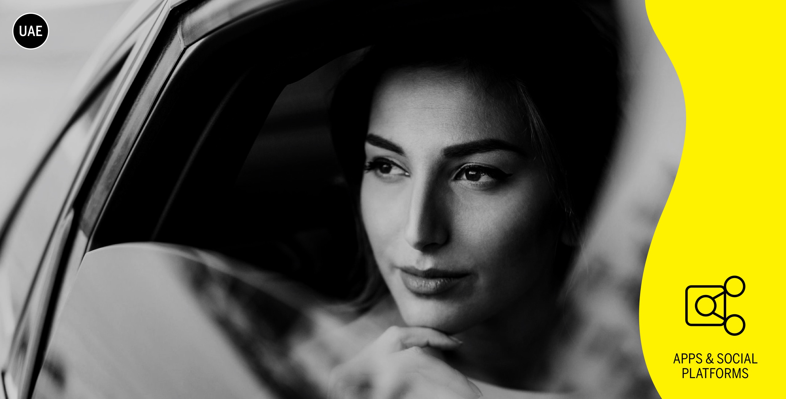 A woman looking out of the window of a car.