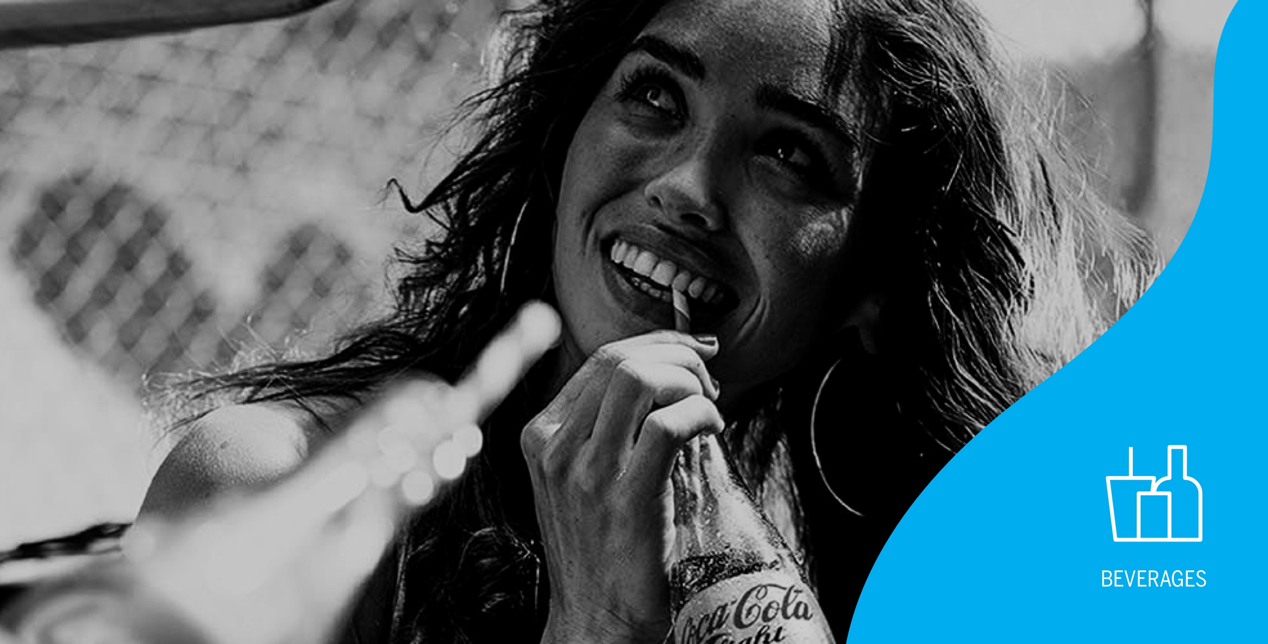 A black and white photo of a woman with a smile on her face.