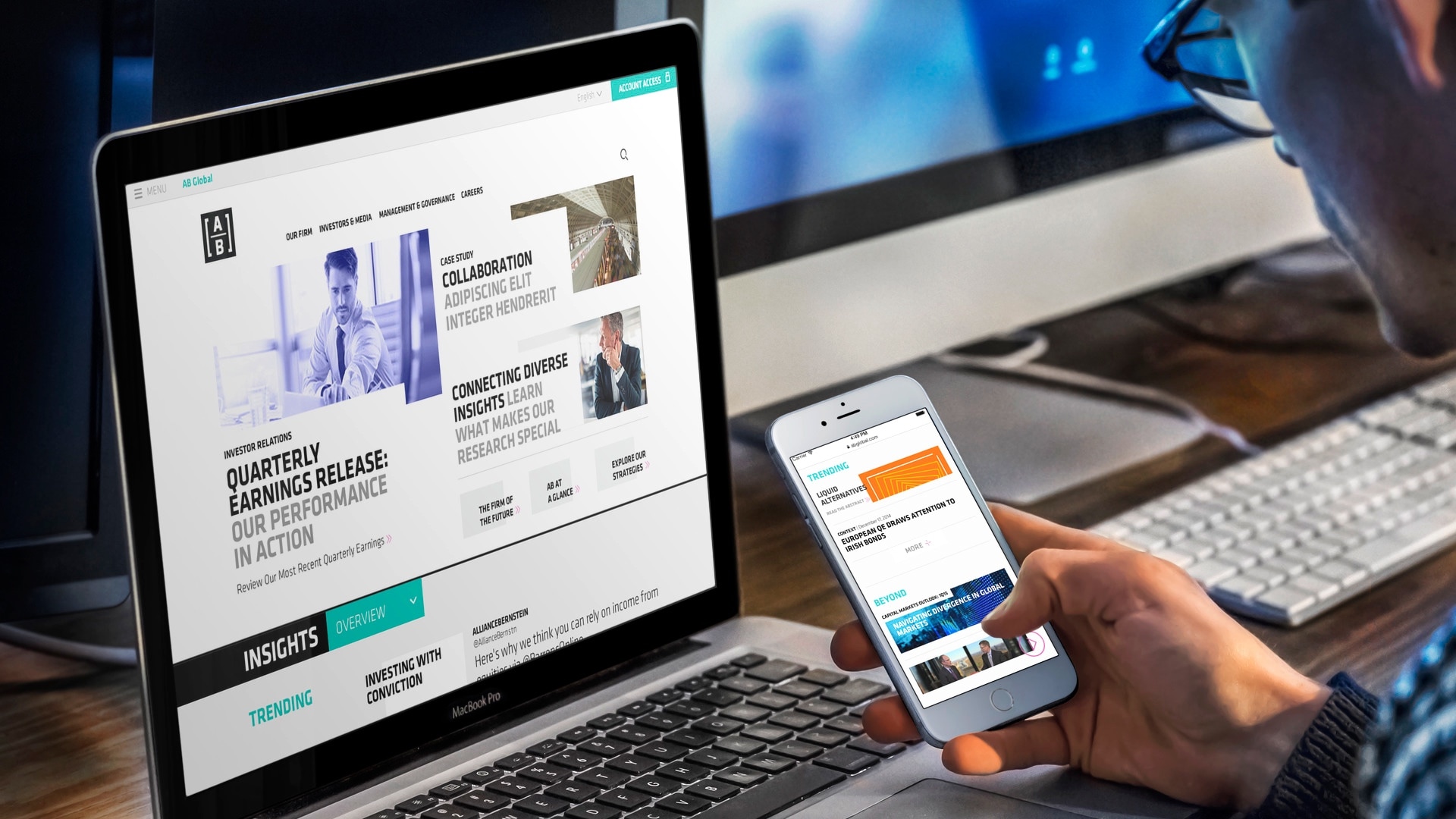 A laptop and a Mobile Phone displaying the website developed for AB (AllianceBernstein)