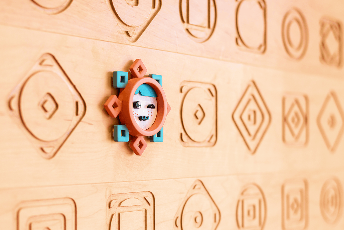 a wall showing wood engraved icons developed for The Yoghurt Lab