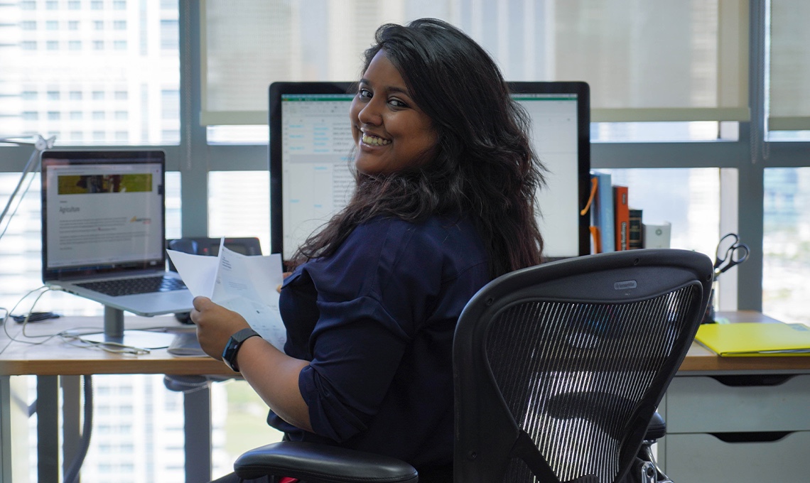 A woman sitting at a desk.