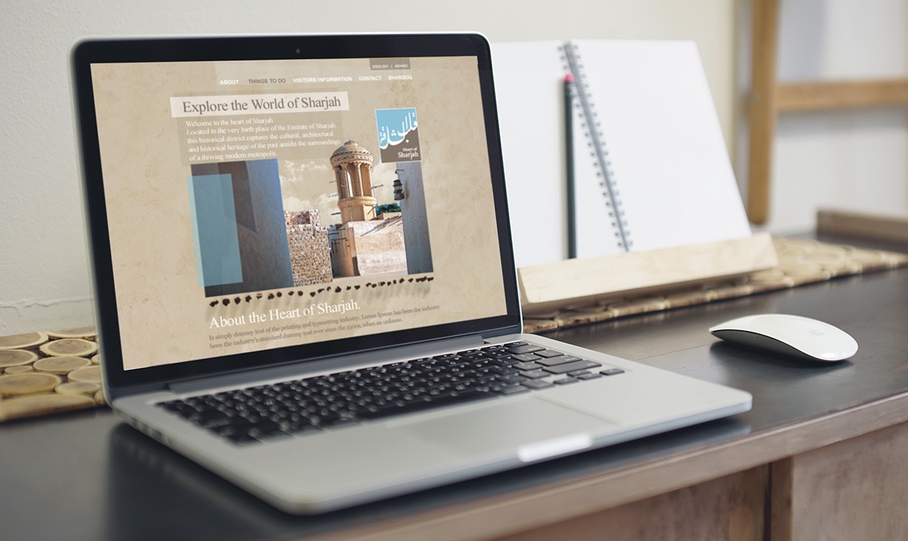 a laptop showing teh website designed to promote the historical heart of the emirate of Sharjah