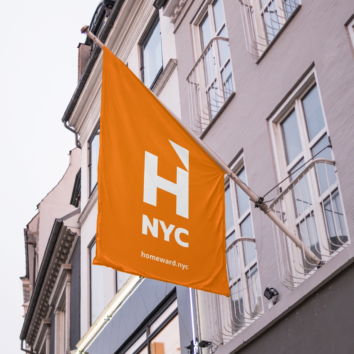 An orange Flagpole banner with the Homeward UK logo in white, showing how the design system could be represented.