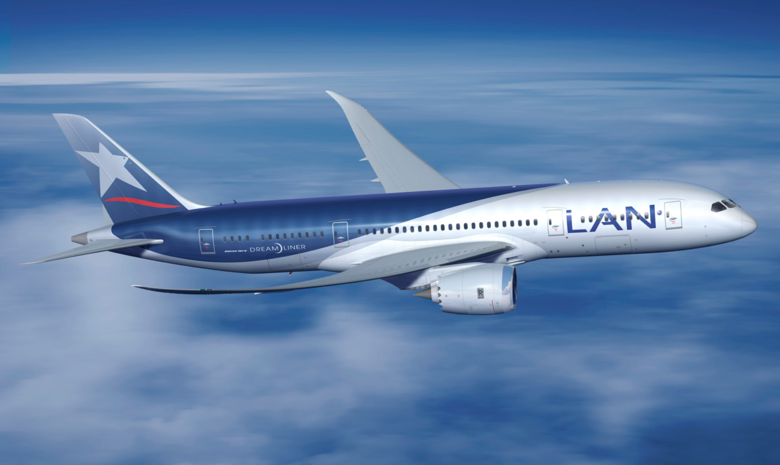 A blue and white airplane flying in the sky with a spacious cabin interior.