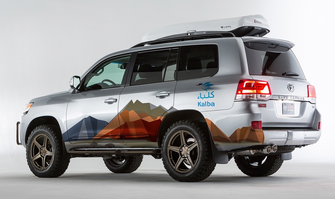 a silver suv with the design system painted on the side.