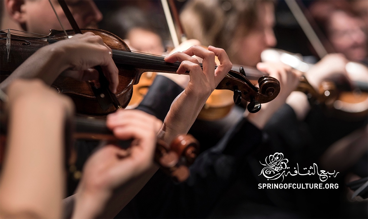 a group of people that are playing violin and the logo of the Spring of Culture