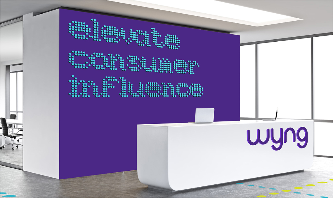 An office with a purple sign that says elect consumer in influence.