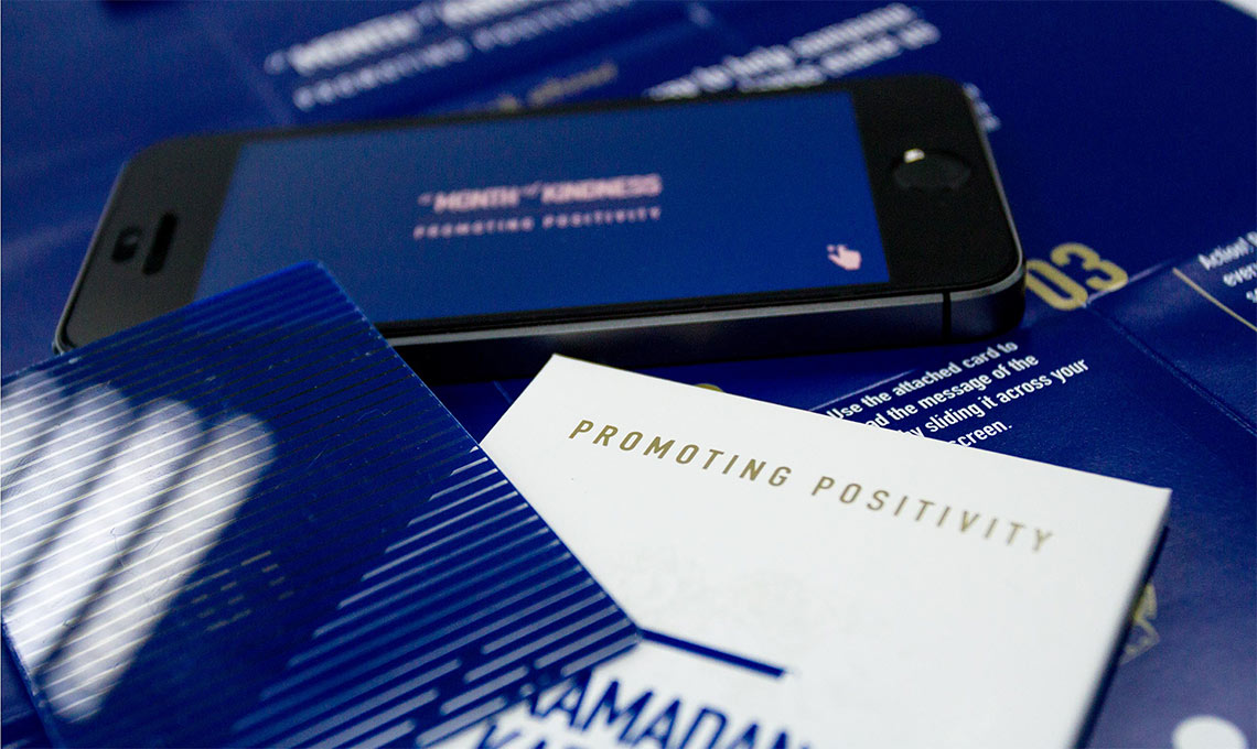 A blue card with a Ramadan greeting on a table.