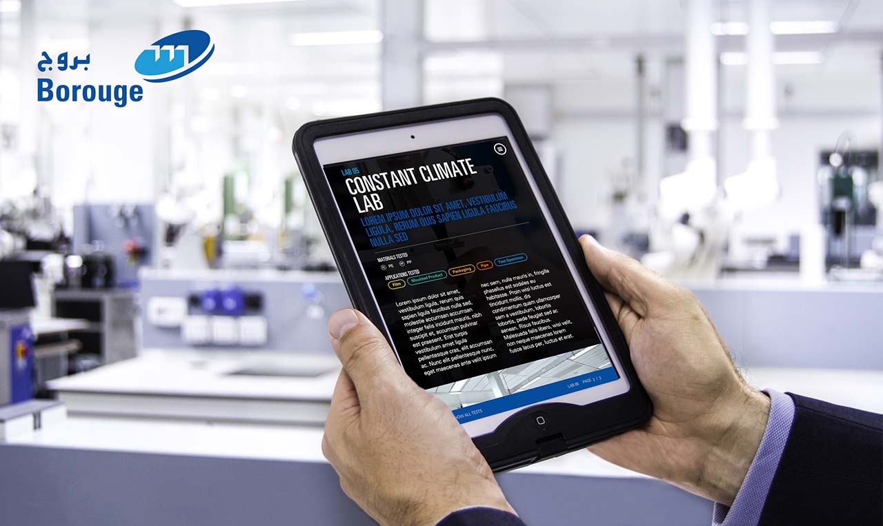 a man showing Interactive touchscreen experiences developed for Borouge on a tablet