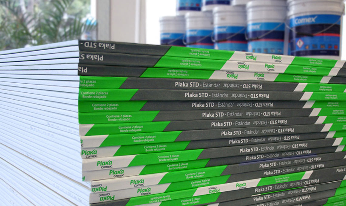 A stack of Plaka books on a table.