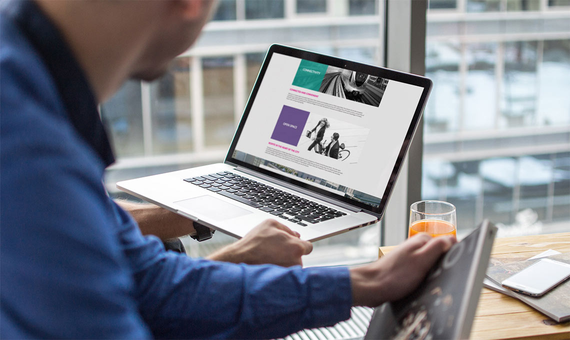 a laptop showing the website developed for One Central brand