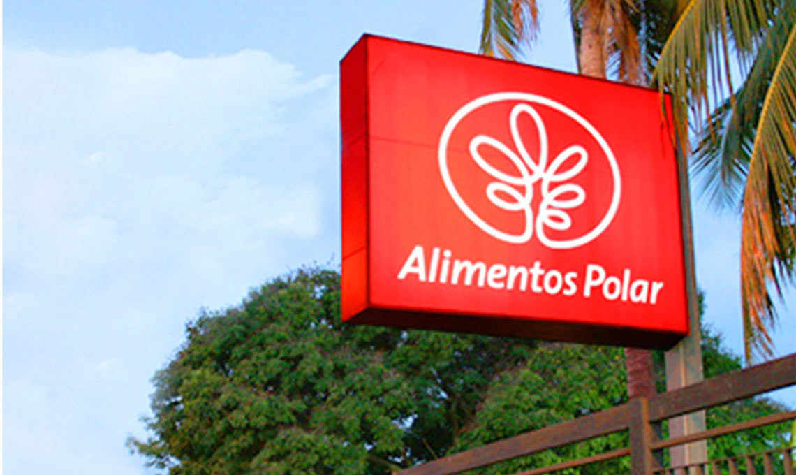 A red sign with a palm tree in the background.