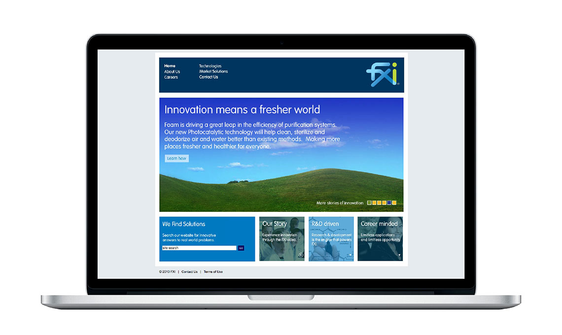 A laptop showing the website developed for FXI