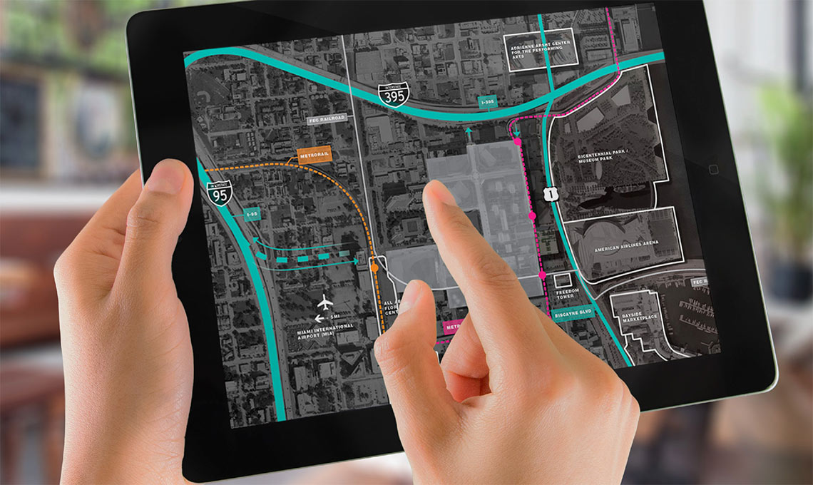 A person using digital tools to explore a new urban destination on an iPad.