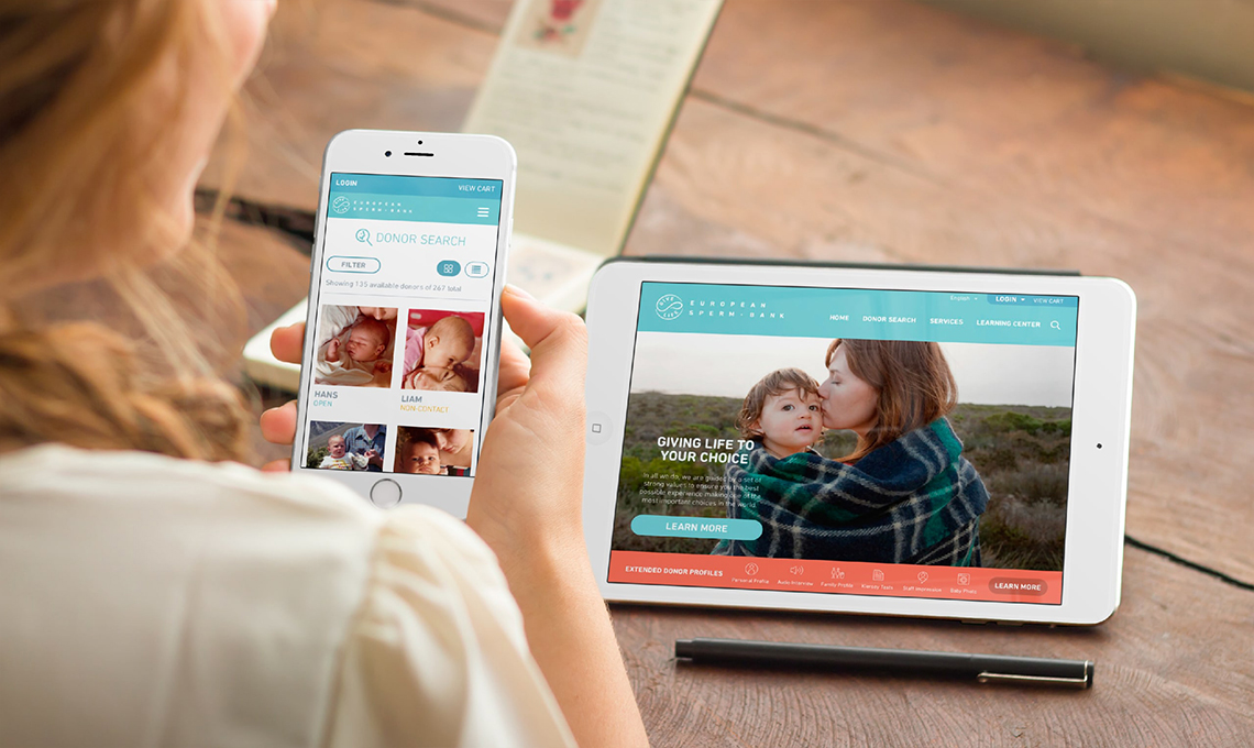 A woman is using an ipad to look at a website during a brand refresh.