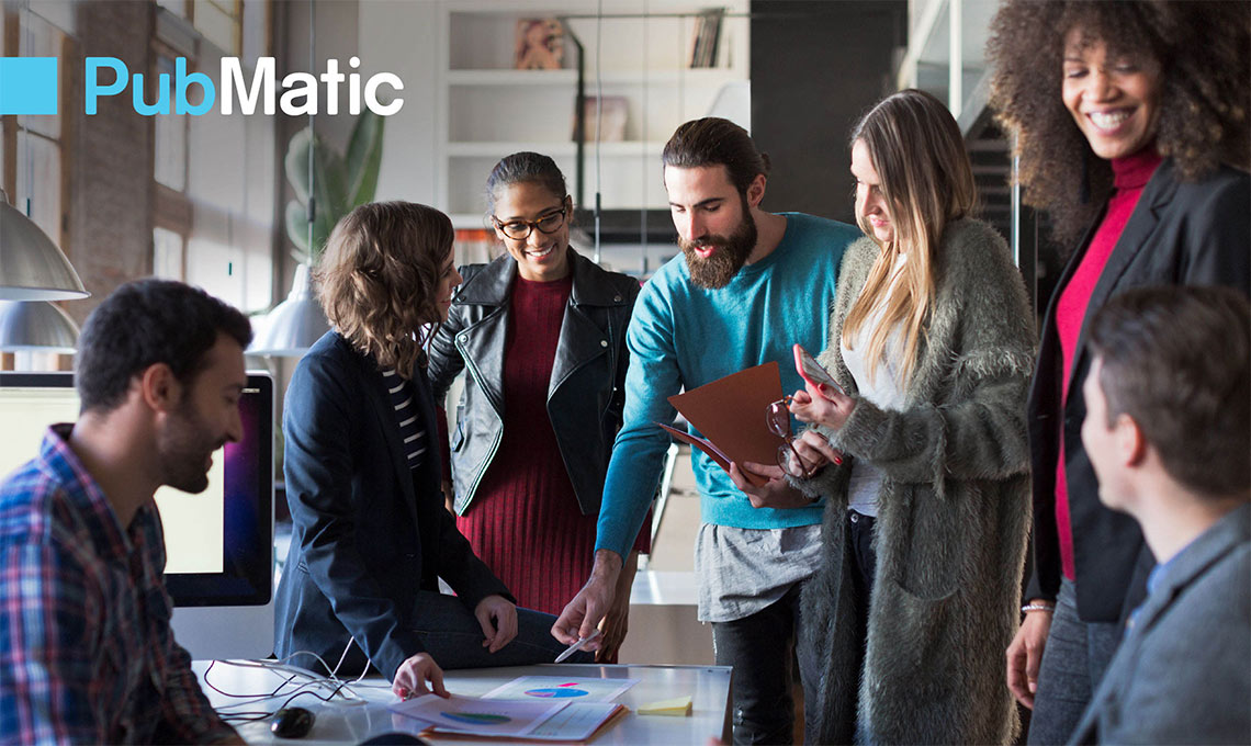 a group of people standing around a table and the logo of PubMatic at the left upper corner