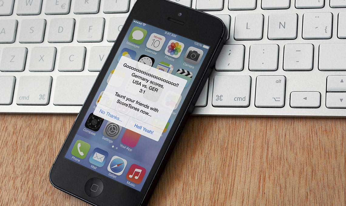 A mobile application is sitting on top of a keyboard.