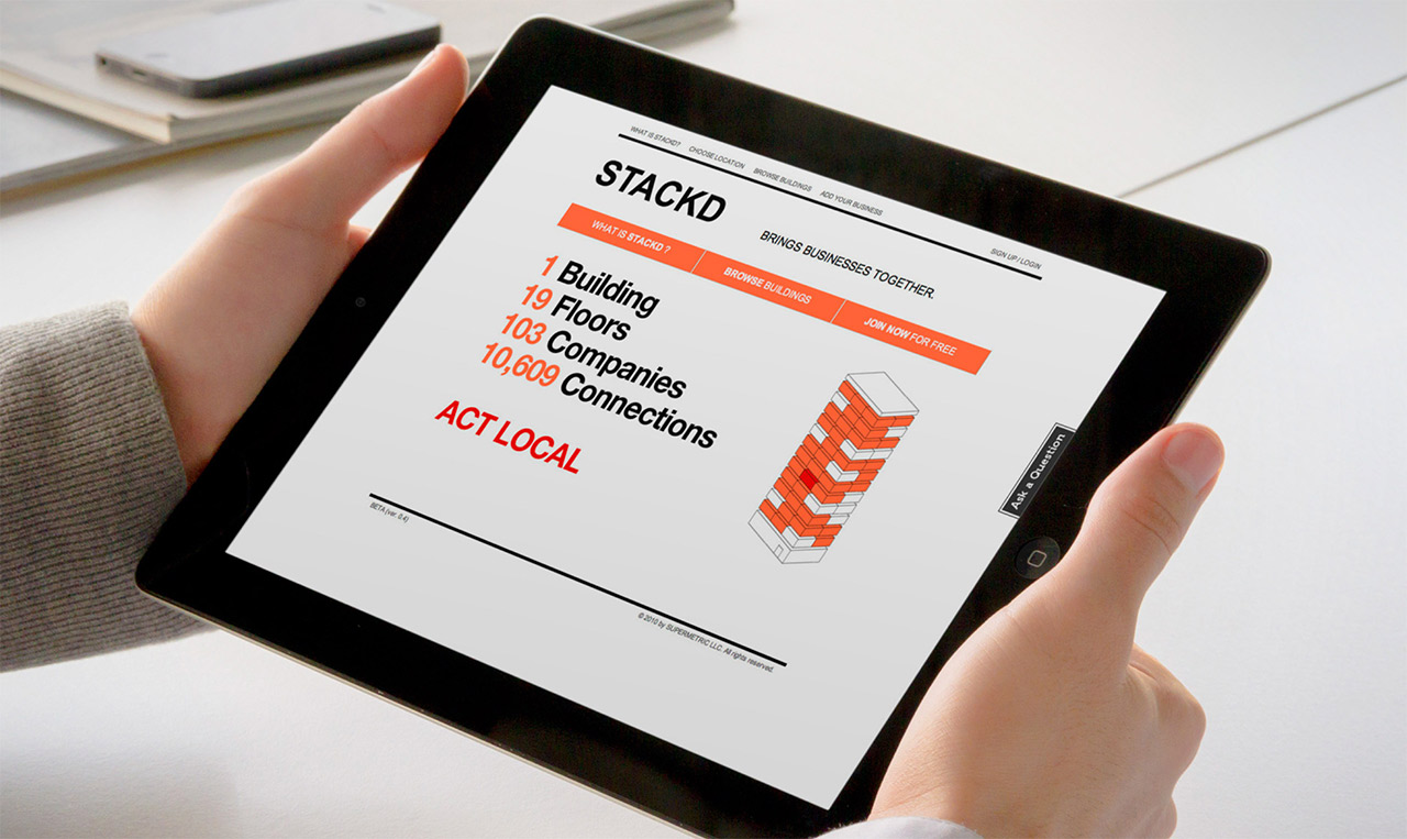 A person holding an ipad with the word cda on it showcasing Stackd.