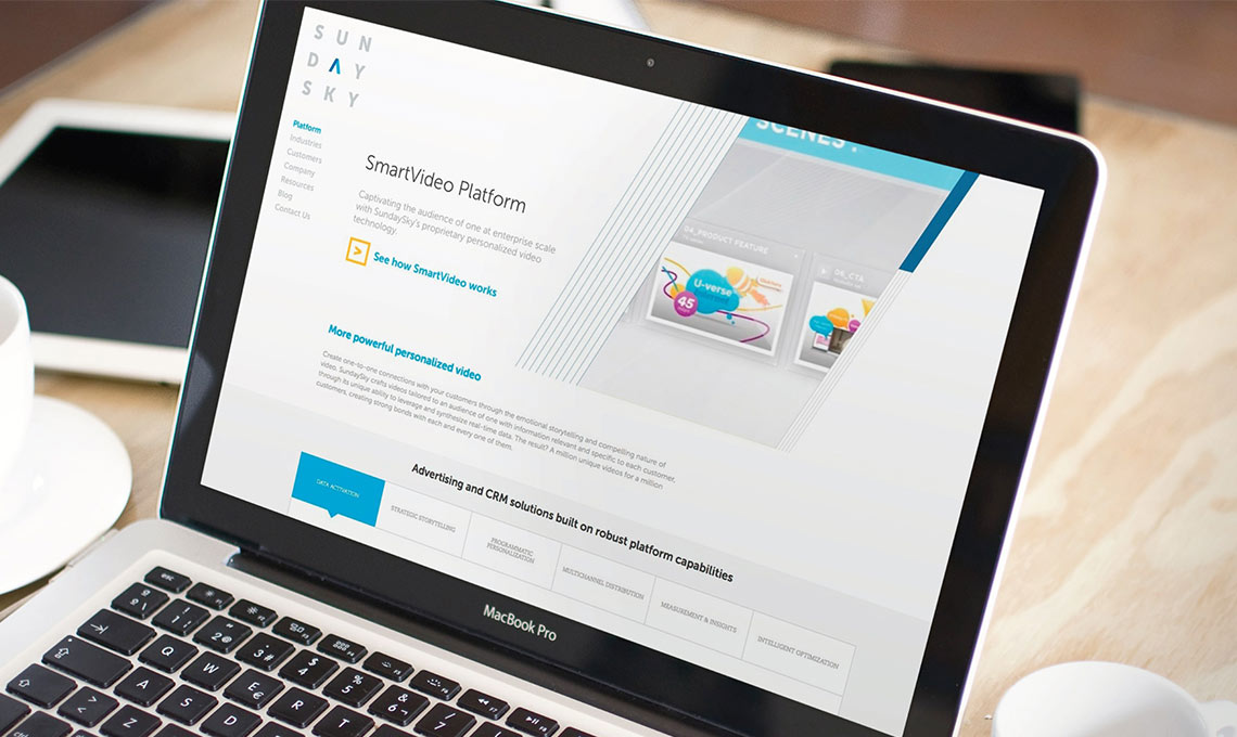 A brand-new laptop is sitting on a table next to a cup of coffee.