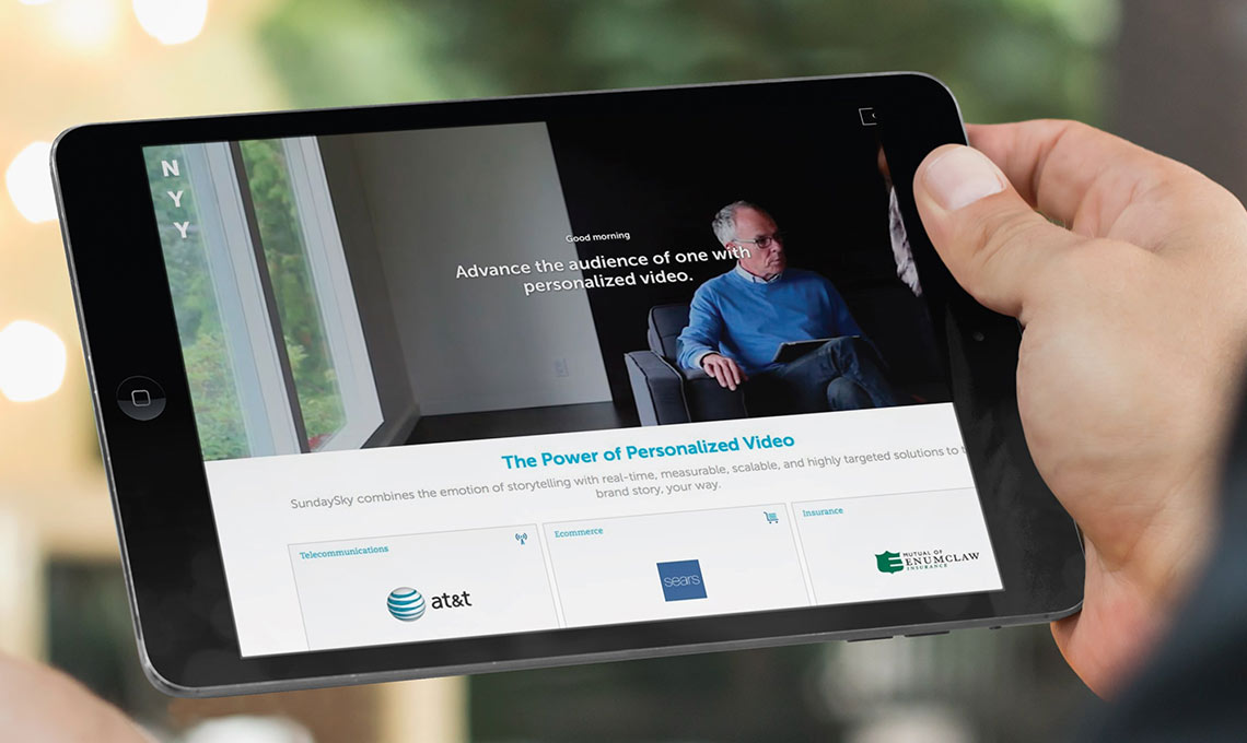 A person showcasing a brand program on an iPad.