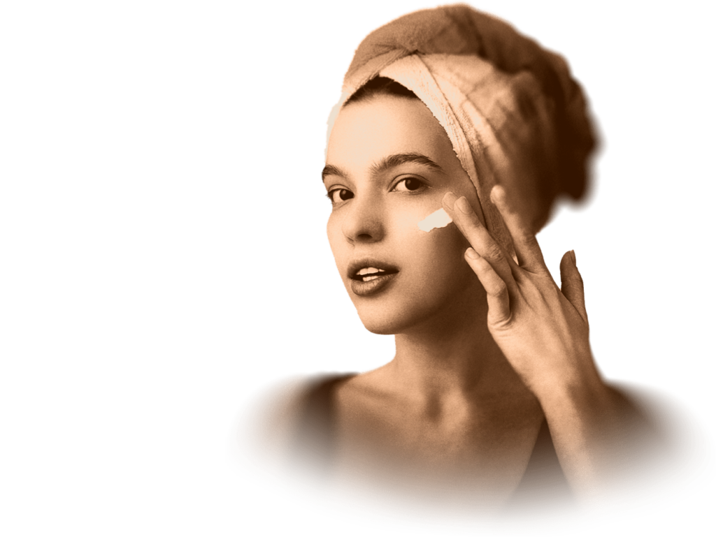 a woman applying cream to her face