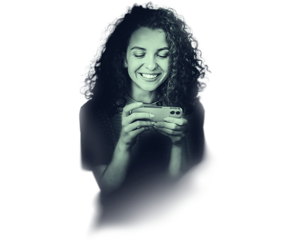 A happy young looking at her smartphone screen