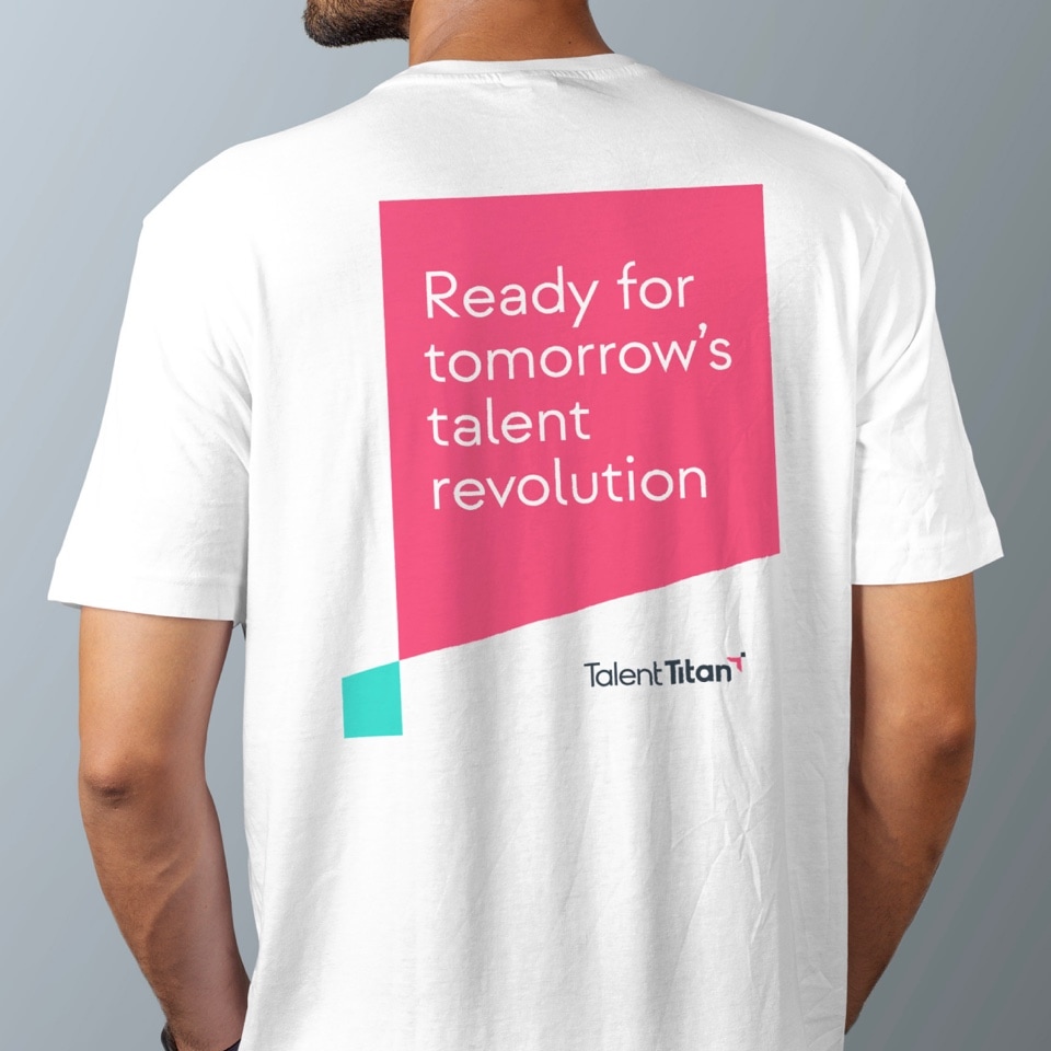 A man wearing a T-shirt with a graphic design developed for Talent Titan.