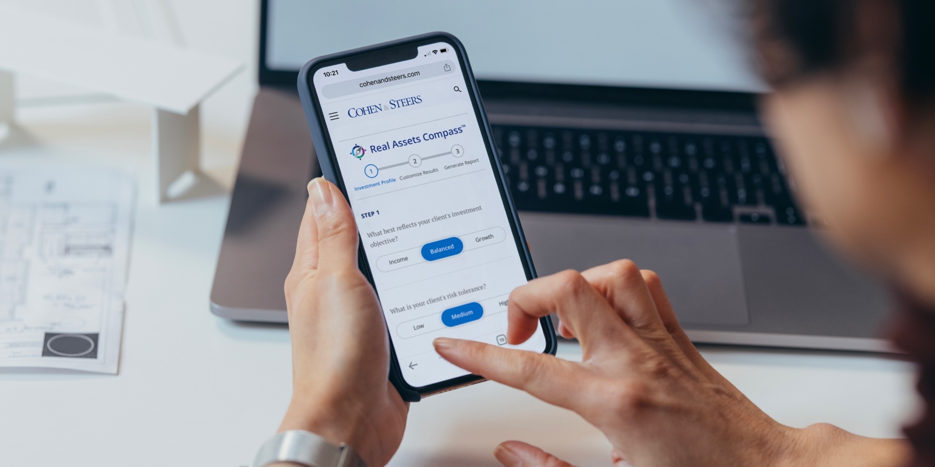 The new Real Asset Compass Tool displayed on a mobile phone