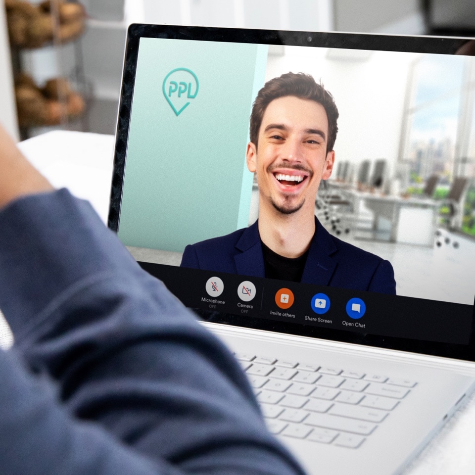 A laptop with a video conference with the background developed for PPL