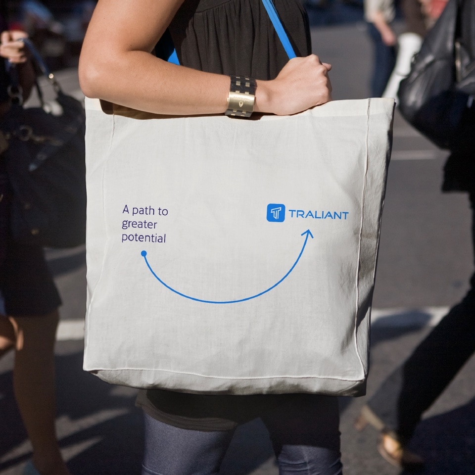 Example of marketing material: a white Tote Bag the Traliant logo in blue