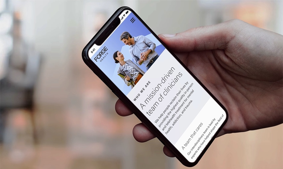 A mobile phone showing the Forge website