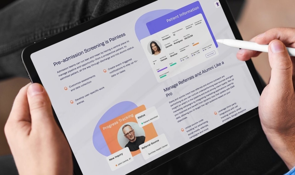 A man holding a tablet displaying the website developed for Kipu