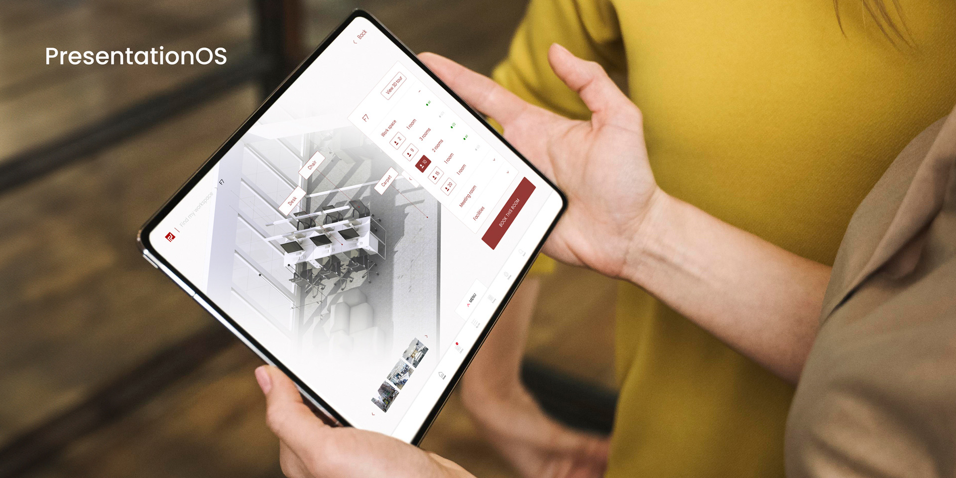 A person viewing the My Workspace office locations via a 3D model on an iPad through the PresentationOS platform.