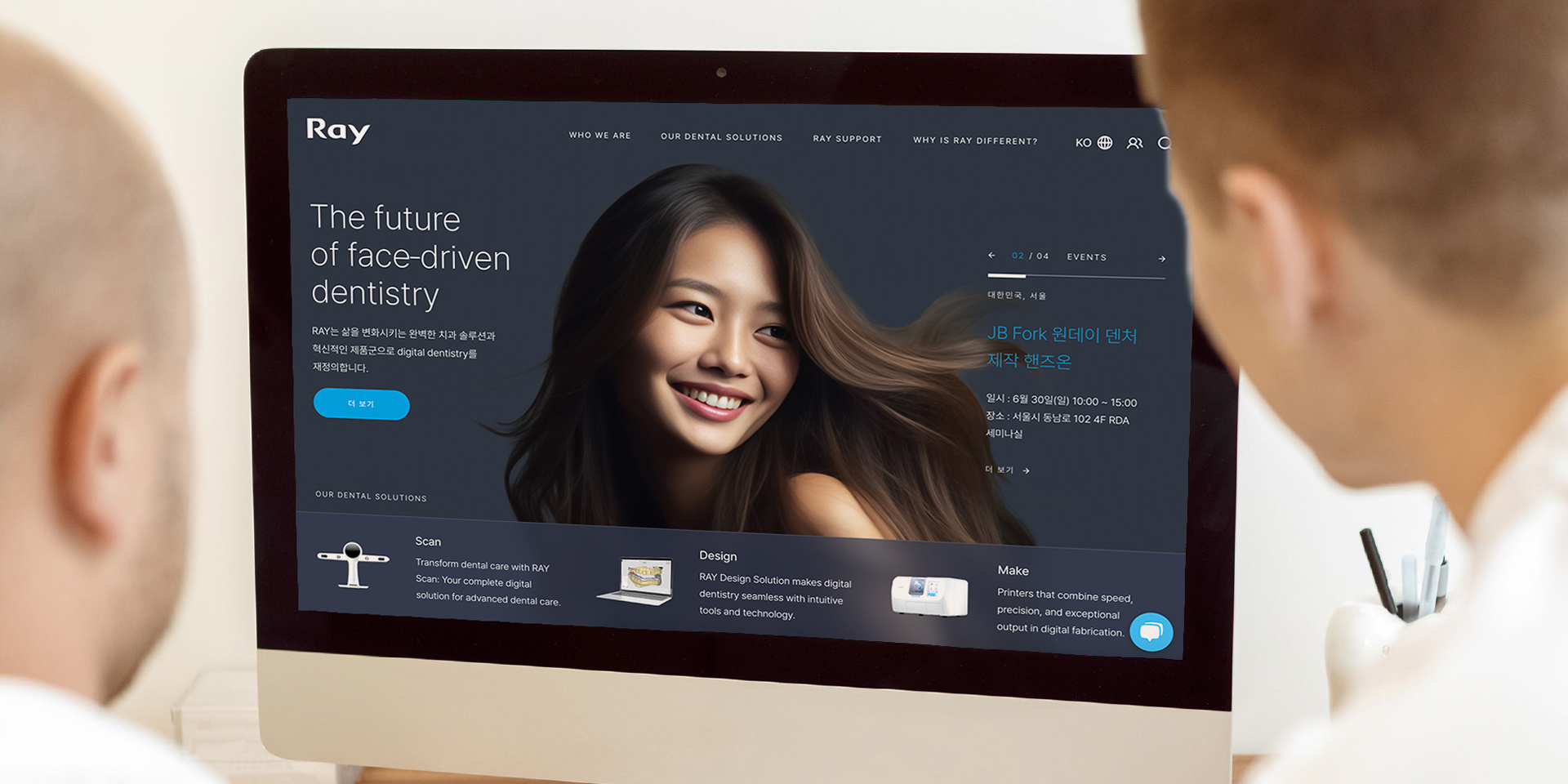 A dentist showcasing the Ray website to a medical patient