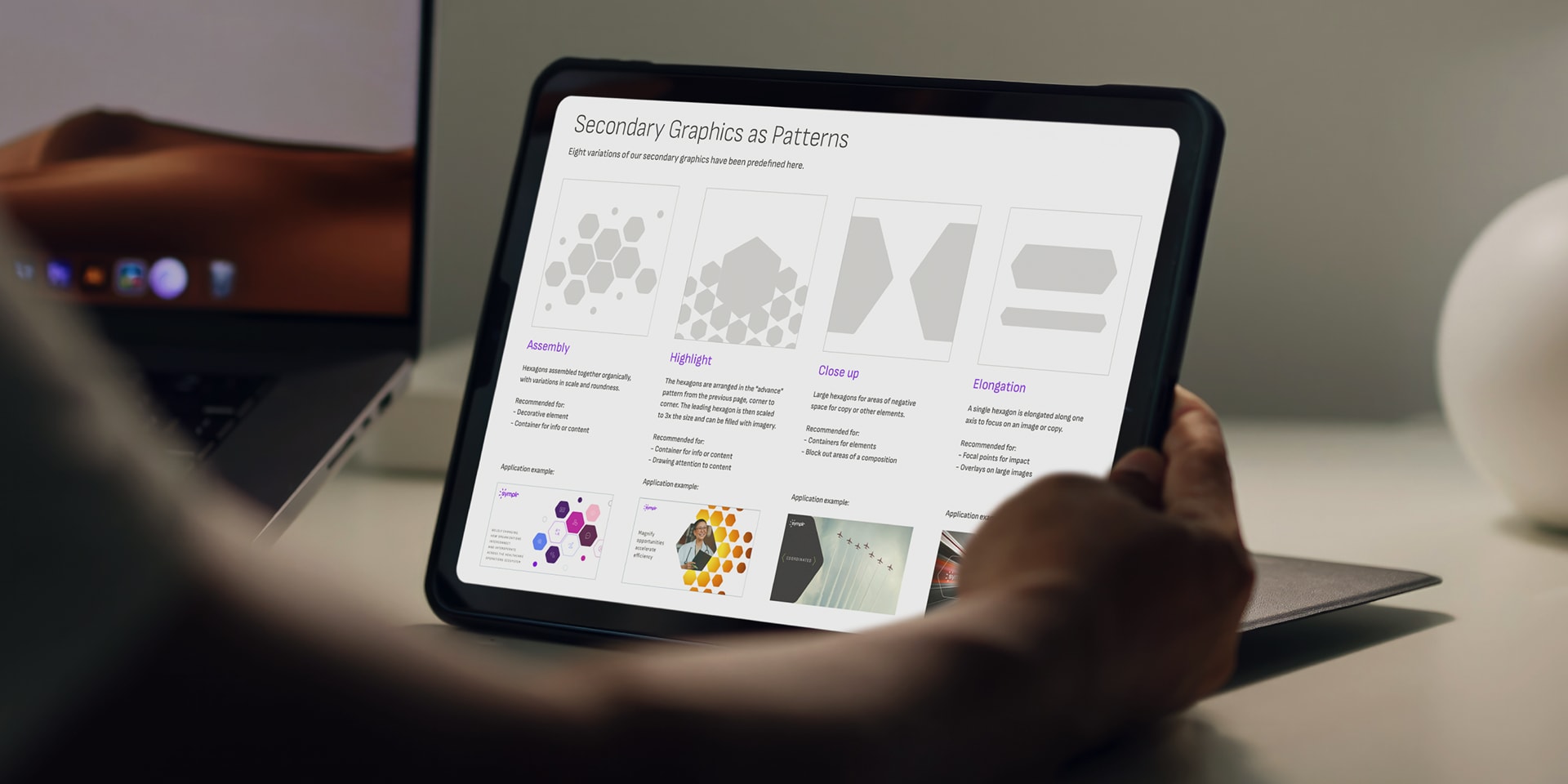 Individual interacting with a tablet, viewing the symplr website featuring various graphics